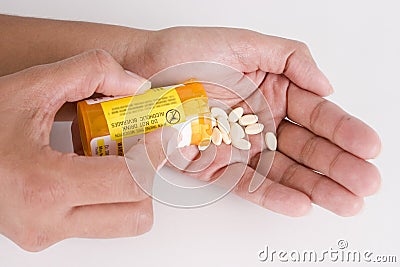 Dispensing Prescription Pills into Hand 1 Stock Photo