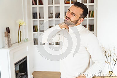 Dispirited bearded male looking into the distance Stock Photo