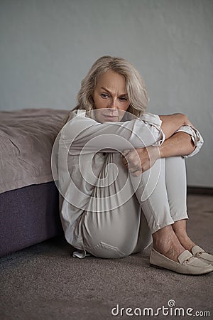 Dispirited mature Caucasian woman suffering from depression Stock Photo