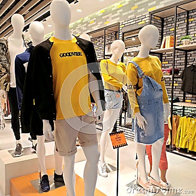 Display arrangement of male and female mannequins in the fashion store Editorial Stock Photo