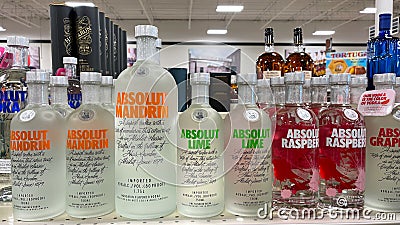 A display of bottles of flavored Absolut Vodka with background bokeh at a Binneys liqour store in Springfield, Illinois Editorial Stock Photo
