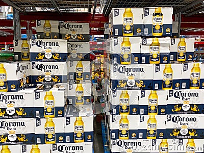 A display of boxes of bottles of Corona Extra on a display shelf of a Sams Club Warehouse Grocery Store Editorial Stock Photo