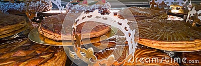 Display of galettes des rois, french kingcakes with a goden crown in a bakery Stock Photo