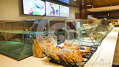 A display glass of the cafetaria selling food and drink indoor Editorial Stock Photo