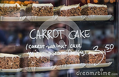 Display at a market stall with cakes behind glass Stock Photo