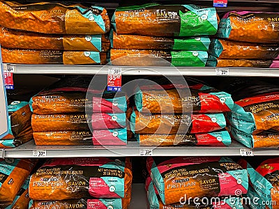 A display of Purina Pro Plan Savor Dog Food at a Petsmart Superstore Editorial Stock Photo