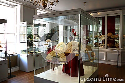 display room with Fans In Glass Display Cabinets In The Fan Museum In Greenwich, London, England Editorial Stock Photo