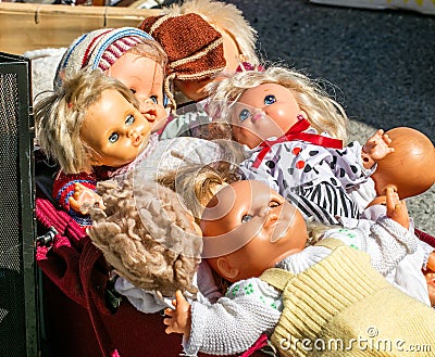 Display of 70s second hand plastic dolls for reusing toys Stock Photo
