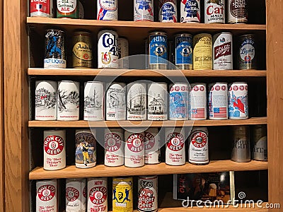 Vintage Beer Cans on Display Shelf Editorial Stock Photo