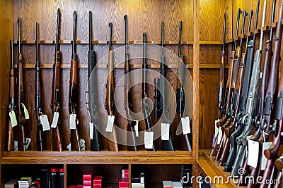 Display stand with hunting and sporting rifles in gun shop Stock Photo