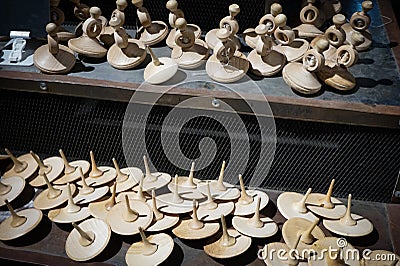 Displayed in the window toy wooden whirligig. Stock Photo