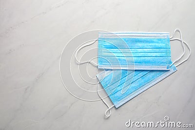 Disposable face mask on light background Stock Photo