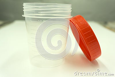 Disposable jars for collection of urine for analysis. Stock Photo