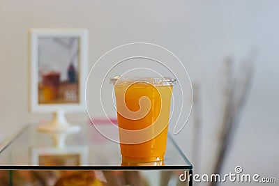 DISPOSABLE PLASTIC CUP DRINKS , plastic cup of orange Stock Photo