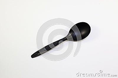 Disposable plastic spoon on white Stock Photo