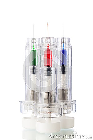 Disposable syringes with multicolored vaccines Stock Photo