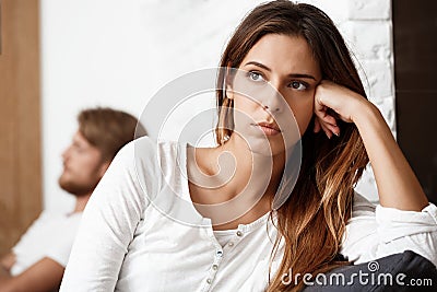 Dissapointed beautiful brunette girl in quarrel with her boyfriend background. Stock Photo