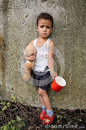 Dissatisfied african american child in dirty Stock Photo