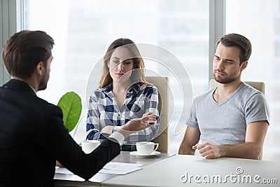 Dissatisfied couple unhappy with houses offered by realtor Stock Photo
