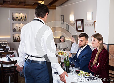 Dissatisfied young couple of guests expressing dissatisfaction Stock Photo