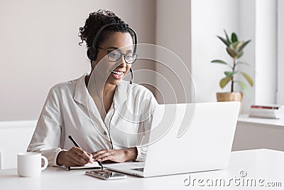 Distance education, e-learning concept. Woman using laptop computer at home, studying online. Student girl working in her room. Wo Stock Photo