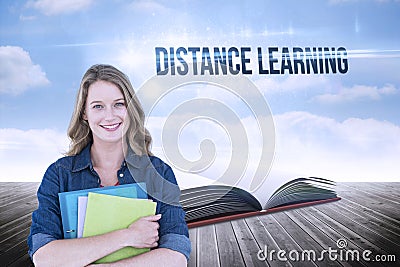 Distance learning against open book against sky Stock Photo