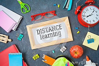 Distance learning and education concept. Study online from home with table and school supplies. Top view from above Stock Photo