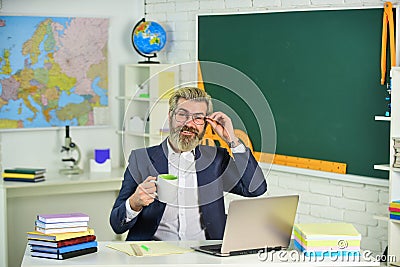 Distance learning. Your application is valid. School project. Back to school. Knowledge day. Man work school teacher sit Stock Photo