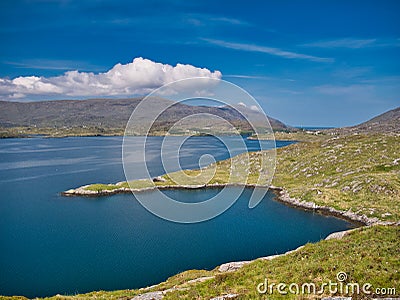 In the distance, the remote community of Tarbert on the Isle Harris in the Outer Hebrides, Scotland, UK. Stock Photo