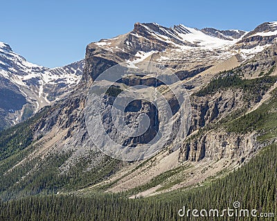 Distant Glacier and Waterfall above Emerald Lake Stock Photo
