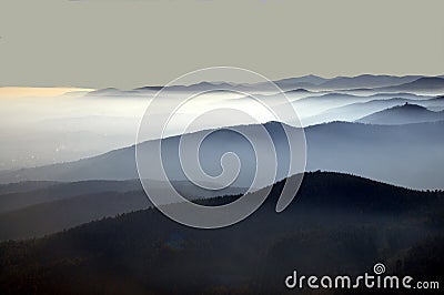 Distant mountain silhouette with clear sky and soft light Stock Photo