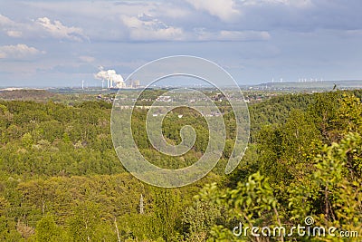 Distant Power Station in Forest Landscape Stock Photo