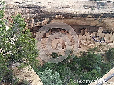 Distant tourist group at ancient ruins at Mesa Verde National Park Stock Photo