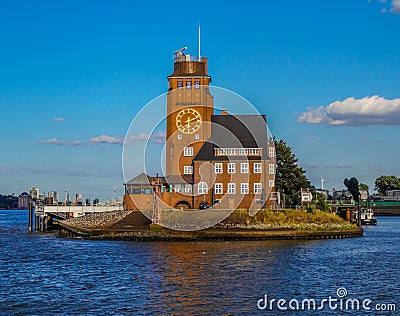 Distant view of a famous clock tower of Venice, Italy, amidst of water with blue sky background. Editorial Stock Photo