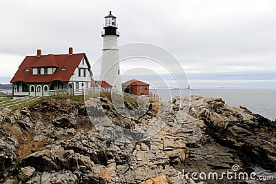 Distant view of Portland Head lighthouse, with stormy skies and rough seas, Maine,2016 Editorial Stock Photo