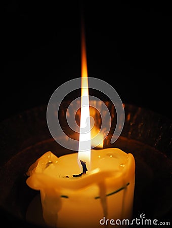 Distinct candle fire, symbol of all saints Stock Photo