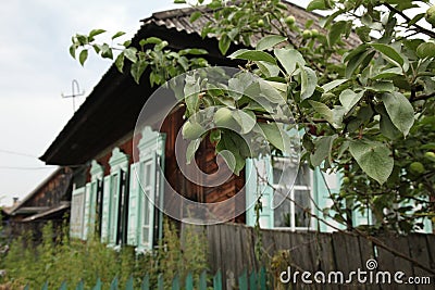 Distinctive vintage wooden village house with retro shutters Stock Photo