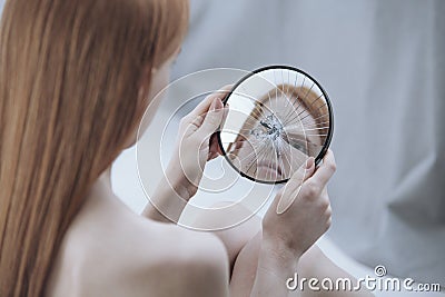 Distorted reflection of a woman Stock Photo