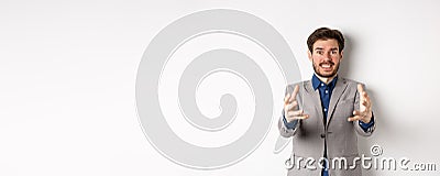 Distressed businessman stretch out hands to strangle annoying person, standing annoyed and frustrated against white Stock Photo