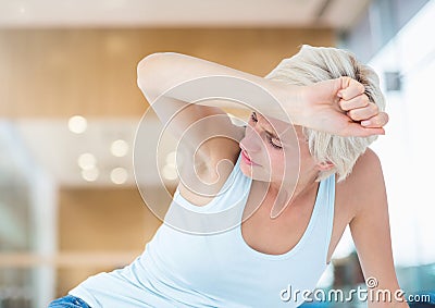 Distressed woman painful in large bright room Stock Photo