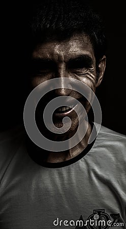 Psychopath man smiling at camera Stock Photo