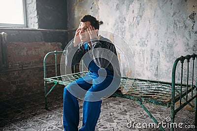 Disturbed madman, face sealed with plaster, crazy Stock Photo
