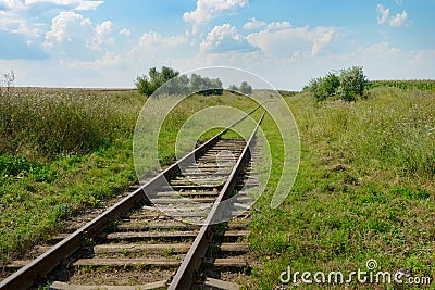 disused railway track on field Stock Photo