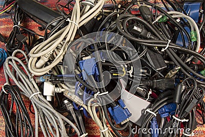 Disused stack of old computer cables and devices. Stock Photo