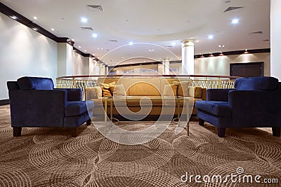 Divan and armchair inside lighting hall Stock Photo