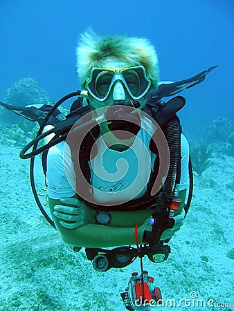 Diver enjoys a sunny dive Stock Photo