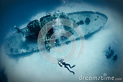 Diver on ship wreck Stock Photo
