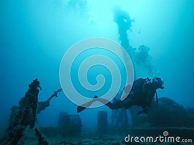 Diver Wreck Diving with Corals Growing on the Wreck in the Red Sea. Stock Photo