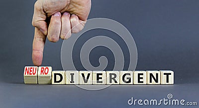 Divergent or neurodivergent symbol. Concept words Divergent Neurodivergent on wooden blocks. Beautiful grey table grey background Stock Photo