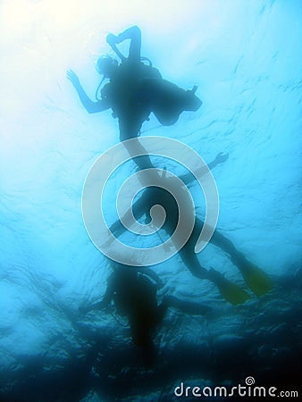 Divers ascending Stock Photo